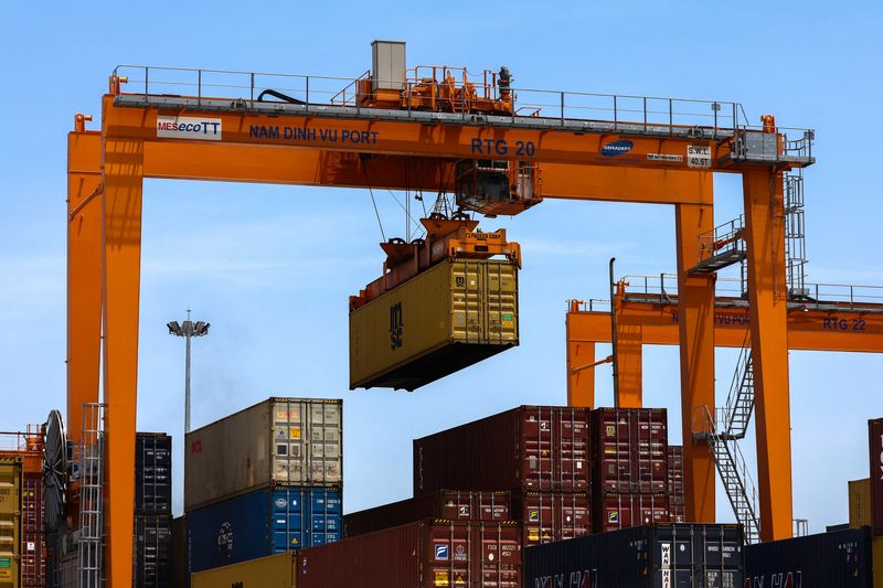 A container is loaded onto a cargo ship while docked at Hai Phong port, in Hai Phong, Vietnam, April 16, 2025. REUTERS/Athit Perawongmetha