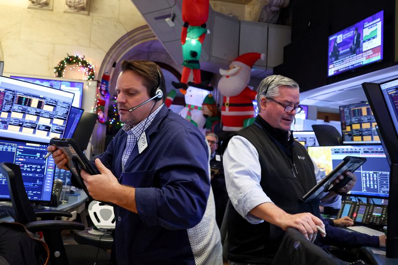 Traders work on the floor at the New York Stock Exchange (NYSE) in New York City, U.S., December 8, 2025.  REUTERS/Brendan McDermid
