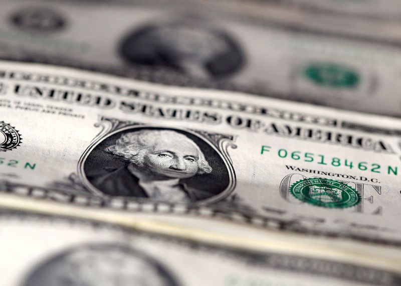 FILE PHOTO: U.S. dollar notes are seen in this November 7, 2016 picture illustration.   REUTERS/Dado Ruvic/Illustration/File Photo