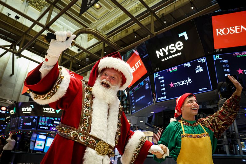 Macy's Santa Claus is greeted by traders on the floor at the New York Stock Exchange (NYSE) in New York City, U.S., November 26, 2025.  REUTERS/Brendan McDermid