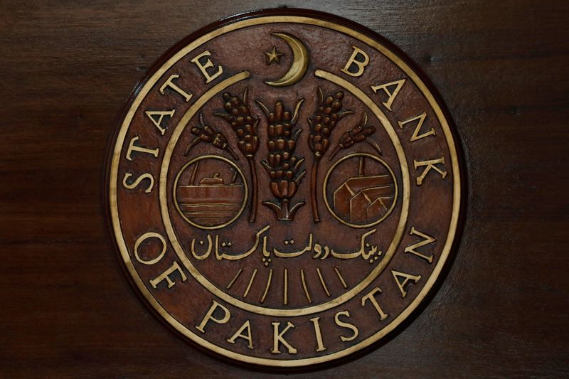 FILE PHOTO: A logo of the State Bank of Pakistan (SBP) is pictured on a reception desk at the head office in Karachi, Pakistan July 16, 2019. REUTERS/Akhtar Soomro/File Photo