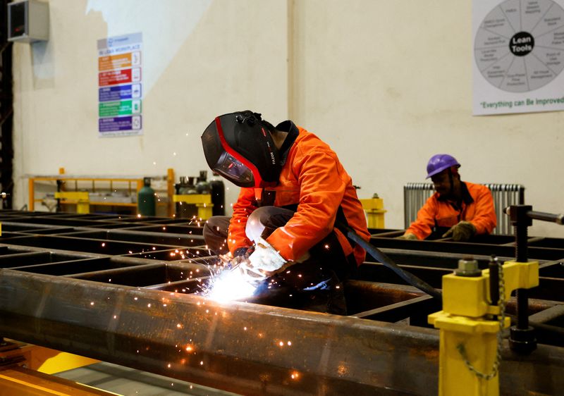 FILE PHOTO: A worker works on a rail component inside a manufacturing unit of Titagarh Rail Systems Ltd. (TRSL) in Uttarpara, India, June 18, 2025. REUTERS/Sahiba Chawdhary/File Photo