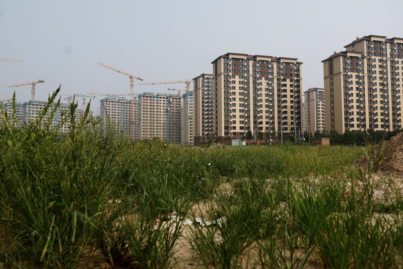 FILE PHOTO: A view shows residential buildings under construction in Beijing, China September 6, 2023. REUTERS/Tingshu Wang/File Photo