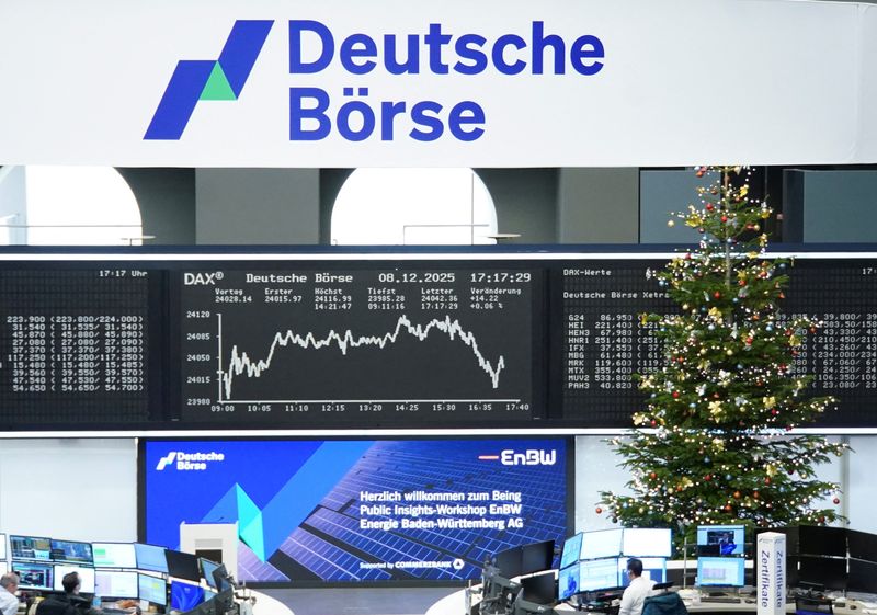 A Christmas Tree stands next to the German share price index DAX graph at the stock exchange in Frankfurt, Germany, December 8, 2025.   REUTERS/staff