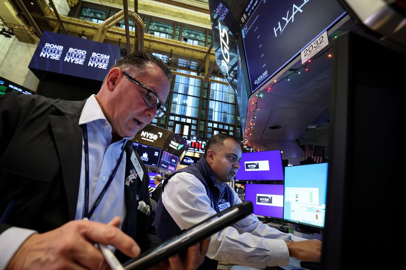 Traders work on the floor at the New York Stock Exchange (NYSE) in New York City, U.S., December 15, 2025. REUTERS/Brendan McDermid