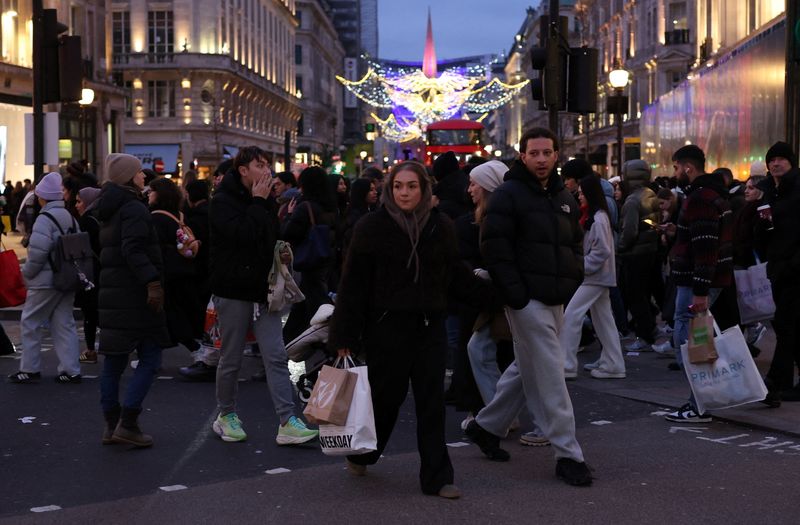 Shoppers walk on Oxford Street during Boxing Day sales, in London, Britain, December 26, 2025. REUTERS/Isabel Infantes