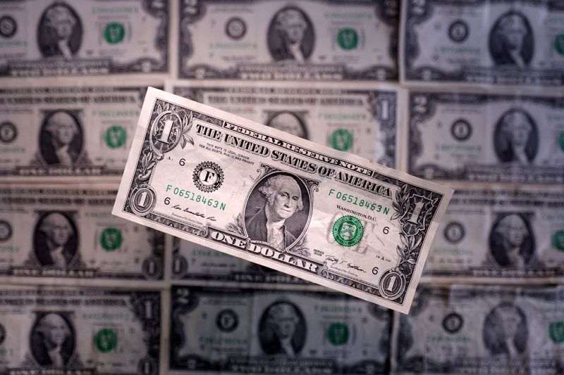FILE PHOTO: U.S. dollar banknotes are seen in this illustration taken March 19, 2025. REUTERS/Dado Ruvic/Illustration/File Photo