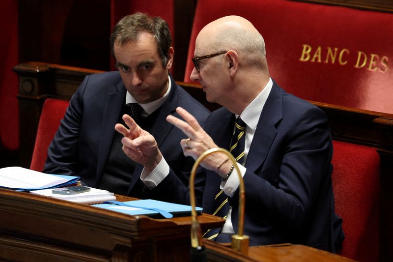 FILE PHOTO: French Prime Minister Sebastien Lecornu and French Minister for Economy, Finance, and Industrial, Energy and Digital Sovereignty Roland Lescure attend a session for a new reading of the draft budget bill for 2026 (PLF 2026) at the National Assembly in Paris, france, January 13, 2026.  REUTERS/Stephanie Lecocq/File Photo