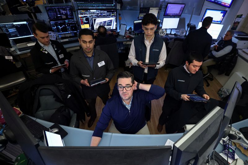 Traders work on the floor at the New York Stock Exchange (NYSE) in New York City, U.S., January 13, 2026.  REUTERS/Brendan McDermid