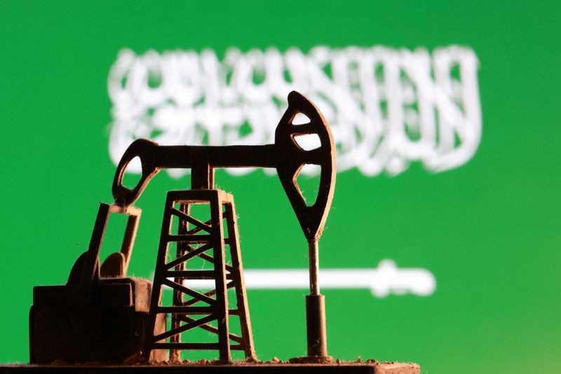 A model of an oil pump is seen in front of a Saudi Arabian flag in this illustration taken January 9, 2026. REUTERS/Dado Ruvic/Illustration