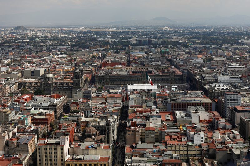 Mexico's national flag flutters in front of the National Palace, as seen from the Torre Latinoamericana in downtown Mexico City, Mexico December 21, 2024. REUTERS/Tomas Bravo