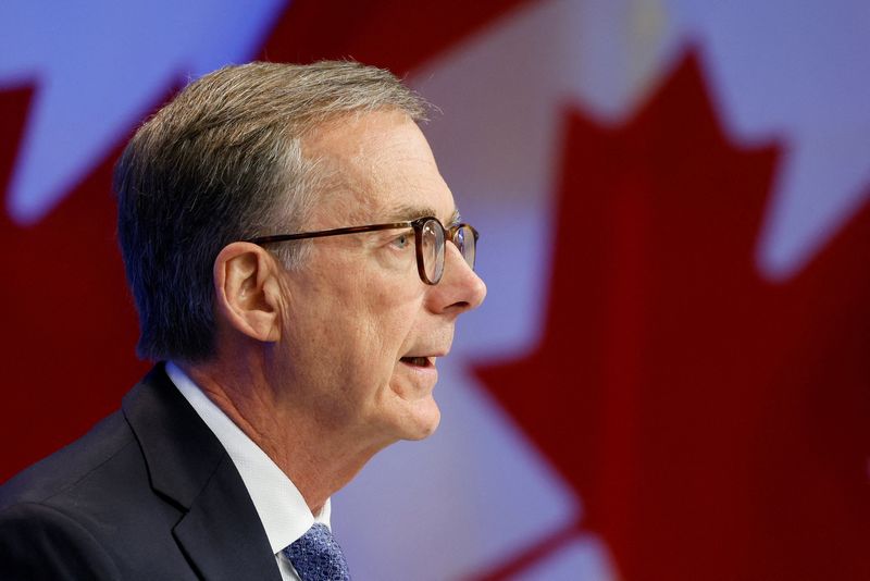 FILE PHOTO: Bank of Canada Governor Tiff Macklem takes part in a press conference, after cutting key interest rate, in Ottawa, Ontario, Canada September 17, 2025. REUTERS/Blair Gable/File Photo