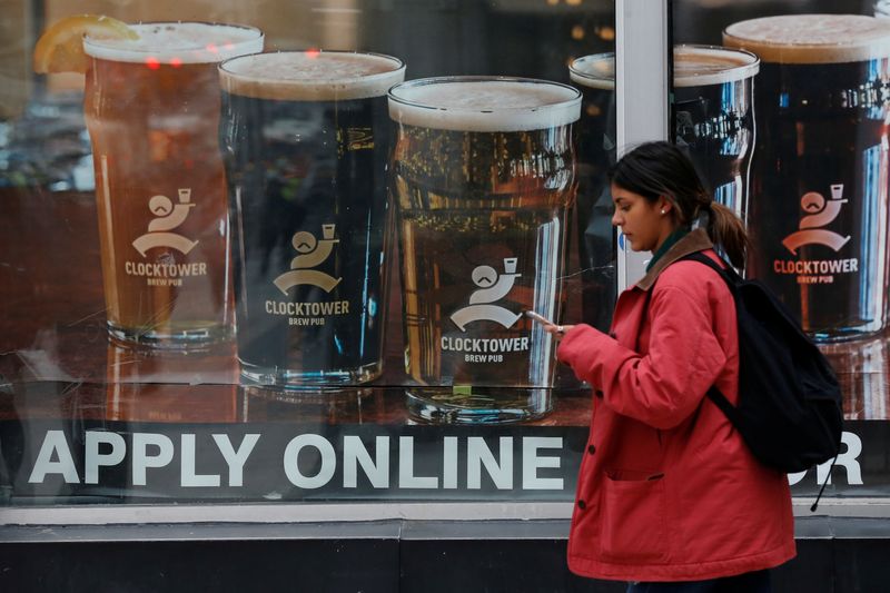 A sign advertising available jobs hangs in a window in Ottawa, Ontario, Canada, November 9, 2017. REUTERS/Chris Wattie/File Photo