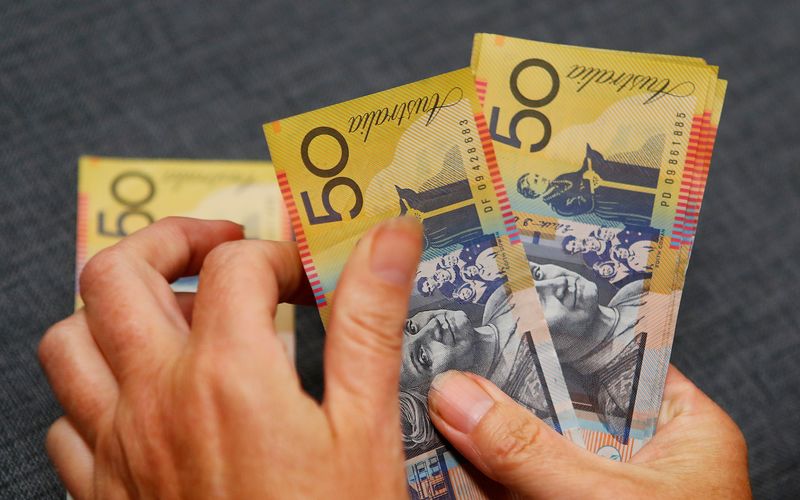 Australian dollars are seen in an illustration photo February 8, 2018. REUTERS/Daniel Munoz