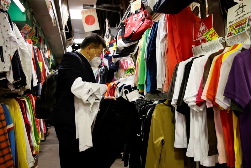 A man shops for clothes at a market in Tokyo, Japan March 3, 2023. REUTERS/Androniki Christodoulou