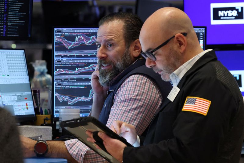 Traders work on the floor at the New York Stock Exchange (NYSE) in New York City, U.S., February 5, 2026. REUTERS/Brendan McDermid