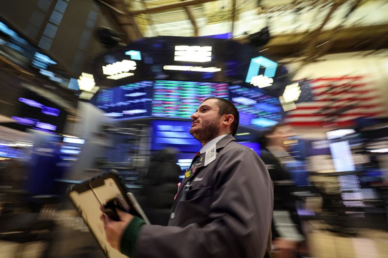 Traders work on the floor at the New York Stock Exchange (NYSE) in New York City, U.S., January 26, 2026.  REUTERS/Brendan McDermid