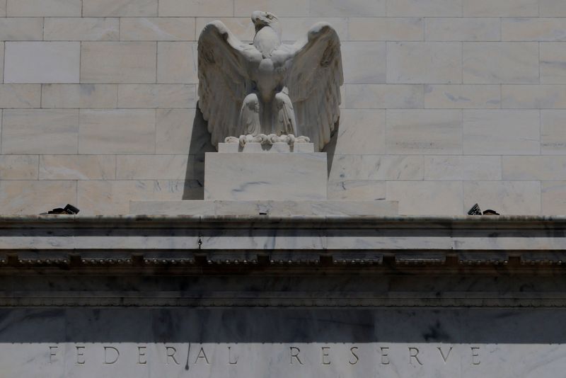An eagle tops the U.S. Federal Reserve building's facade, as U.S. President Donald Trump said he was firing Federal Reserve Governor Lisa Cook over alleged improprieties in obtaining mortgage loans, in Washington, D.C., U.S., August 26, 2025.   REUTERS/Brian Snyder