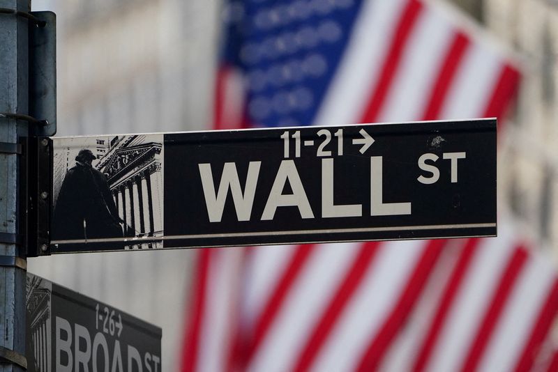 FILE PHOTO: The Wall Street sign is pictured at the New York Stock Exchange (NYSE) in the Manhattan borough of New York City, New York, U.S., March 9, 2020. REUTERS/Carlo Allegri/File Photo
