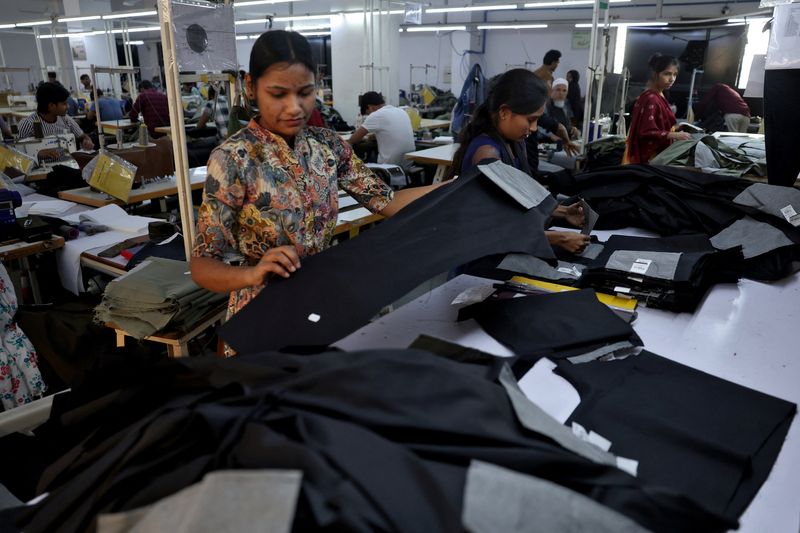 Workers check trousers at a garment manufacturing unit on the outskirts of Ahmedabad, India, January 29, 2026. REUTERS/Amit Dave