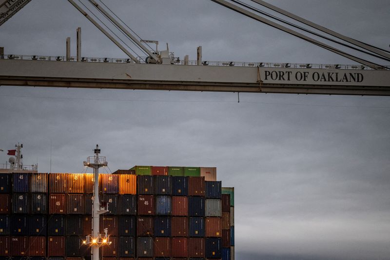 FILE PHOTO: Shipping containers are stacked up at the port of Oakland, in Oakland, California, U.S., February 24, 2026. REUTERS/Carlos Barria/File Photo