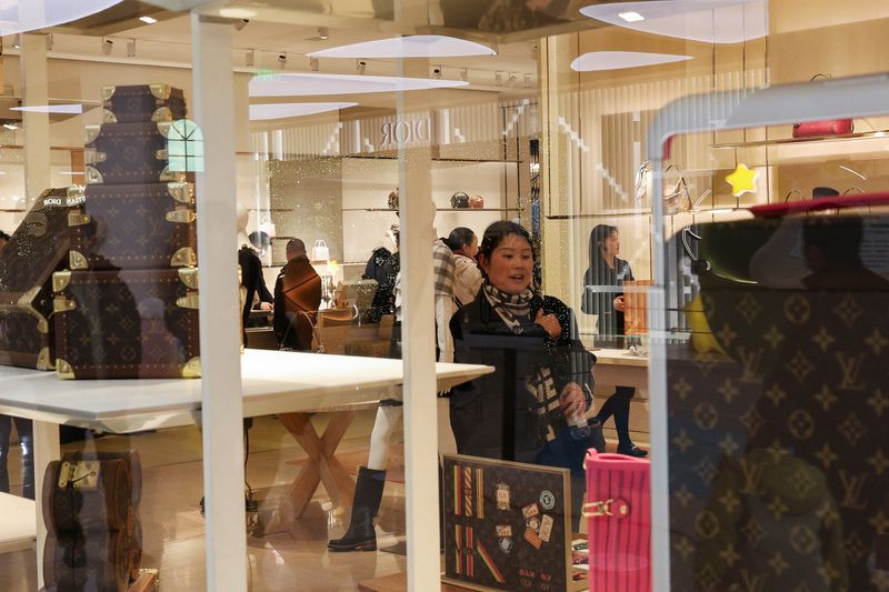People shop in Deji Plaza shopping mall in Nanjing, Jiangsu Province, China, December 12, 2025.  REUTERS/Go Nakamura