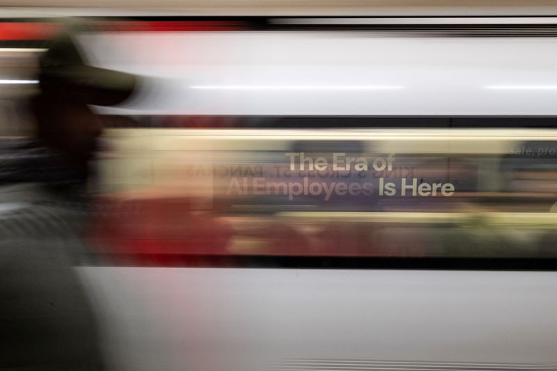 A London underground train passes a billboard for an Artificial Intelligence company advertising AI employees in London, Britain, June 5, 2025. REUTERS/Chris J. Ratcliffe