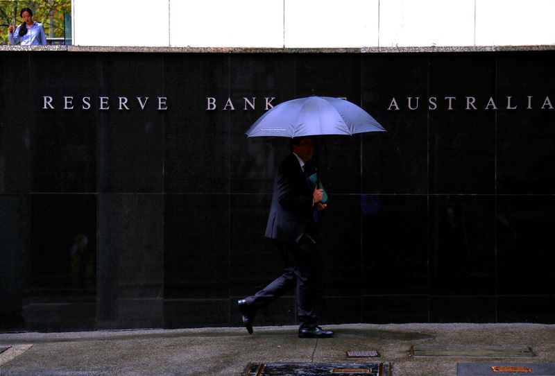 Pedestrians walk past the Reserve Bank of Australia building in central Sydney, Australia, March 7, 2017. REUTERS/David Gray