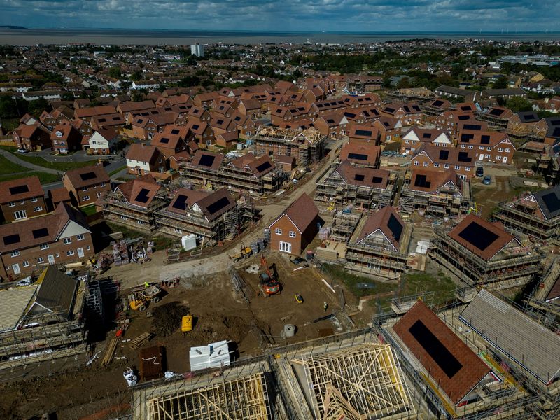 FILE PHOTO: A drone view shows construction work taking place on new homes in Whitstable, Britain, September 11, 2024. REUTERS/Chris J. Ratcliffe/File Photo