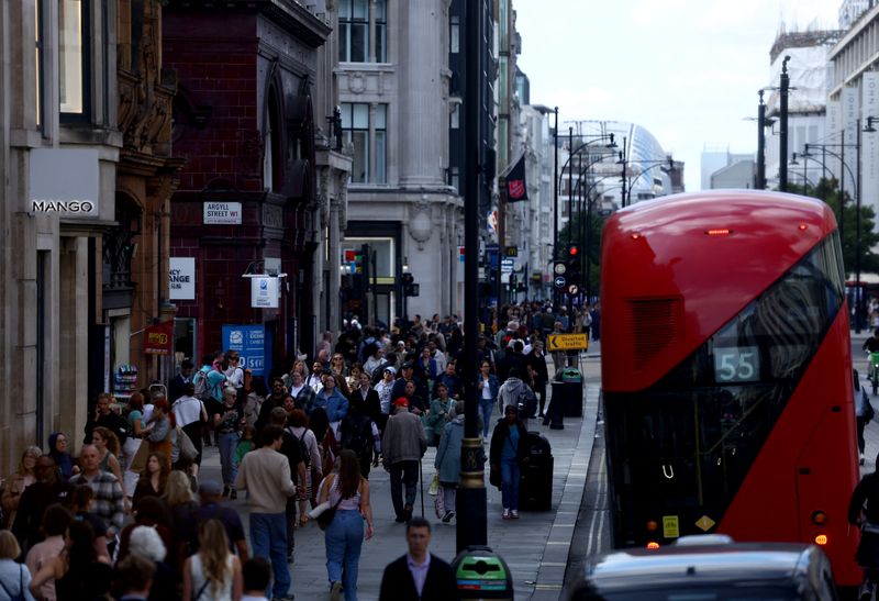 Pedestrians walk as traffic drives along Oxford Street in London, Britain, September 17, 2024. REUTERS/Hannah McKay
