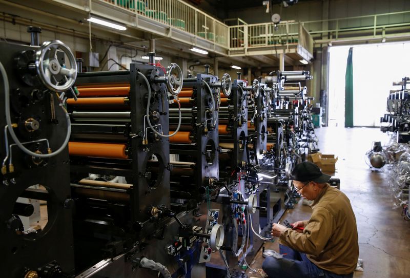 FILE PHOTO: A worker checks machinery at a factory in Higashiosaka, Japan June 23, 2022. REUTERS/Sakura Murakami/File Photo