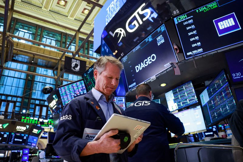 Traders work on the floor at the New York Stock Exchange (NYSE) in New York City, U.S., March 17, 2026.  REUTERS/Brendan McDermid