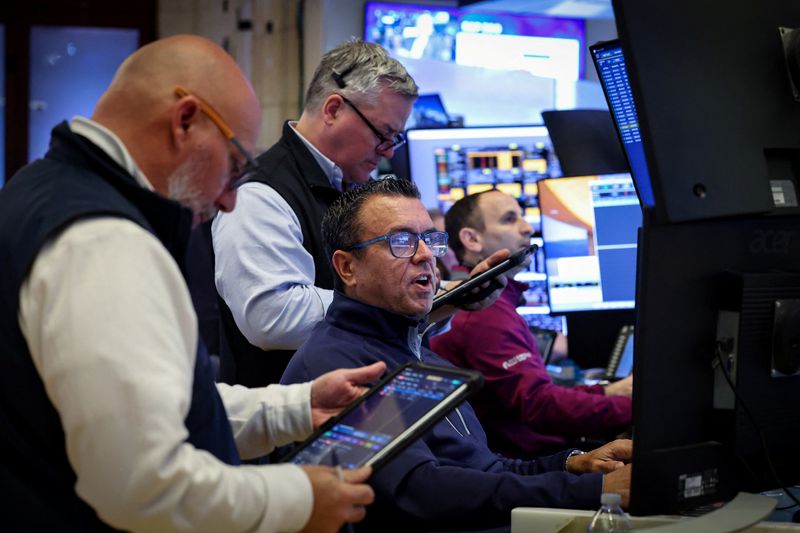Traders work on the floor at the New York Stock Exchange (NYSE) in New York City, U.S., March 6, 2026.  REUTERS/Brendan McDermid