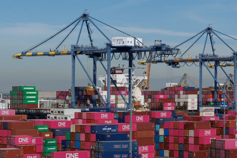 Shipping containers are shown stacked together on Terminal Island at the port of Los Angeles in Los Angeles, California, U.S., February 24,  2026.  REUTERS/Mike Blake