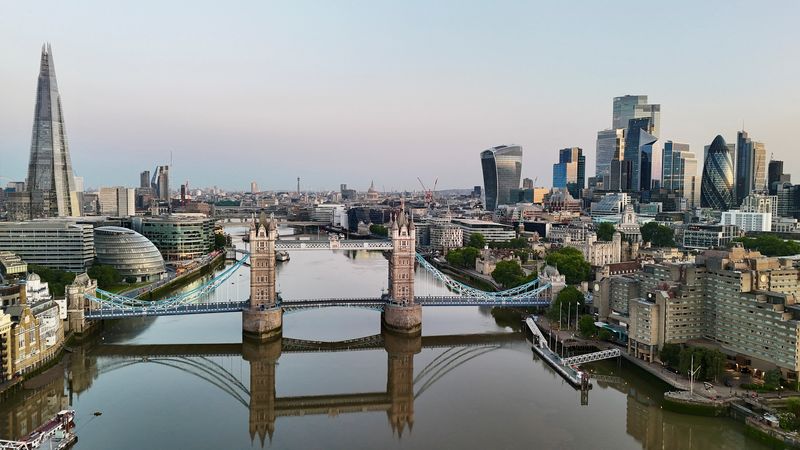 A drone view of The Shard, Tower Bridge and the City of London at daybreak, in London Britain June 19, 2025. June 19, 2025. REUTERS/Yann Tessier