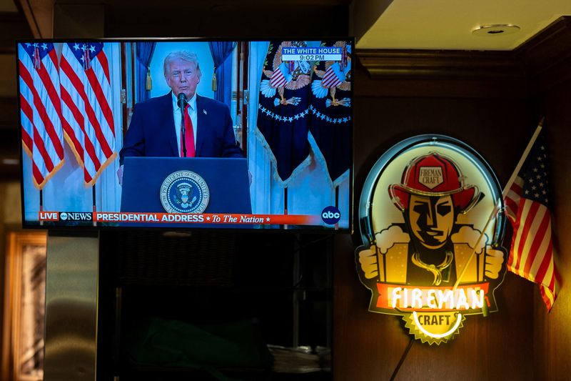 U.S. President Donald Trump appears on a television at Brooklyn Diner in Times Square, as he addresses the nation on the Iran crisis from the White House in Washington, D.C., in New York, U.S., April 1, 2026. REUTERS/David Dee Delgado