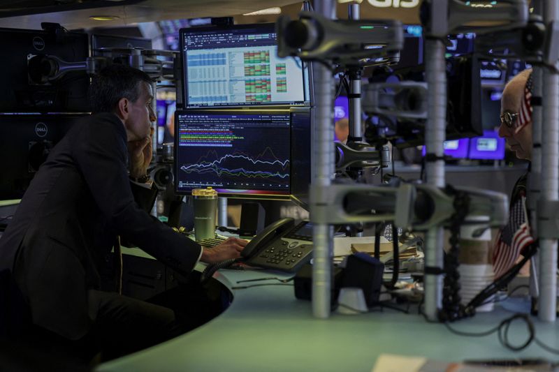 Traders work on the floor at the New York Stock Exchange (NYSE) in New York City, U.S., April 2, 2026. REUTERS/Jeenah Moon