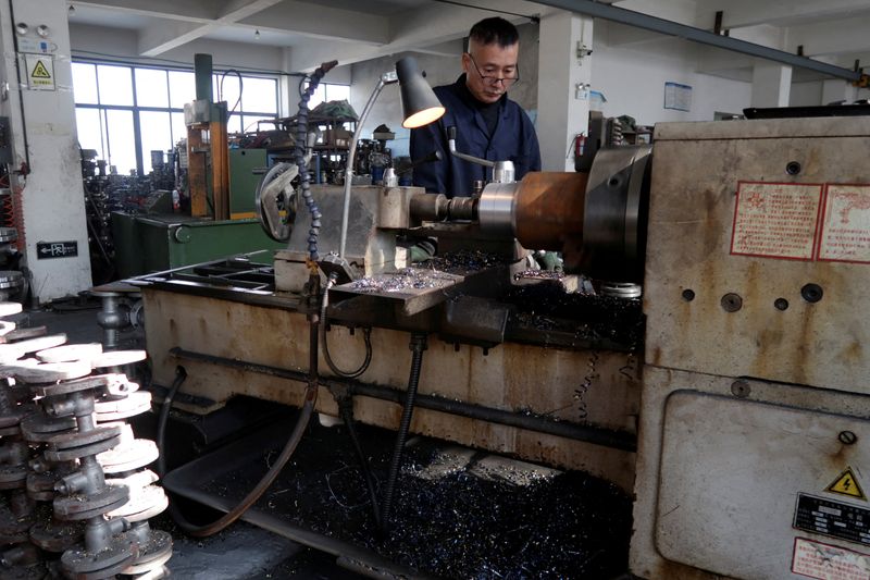 FILE PHOTO: An employee works on the production line manufacturing pipe-fitting valves at a factory in Wenzhou, Zhejiang province, China January 14, 2026. REUTERS/Josh Arslan/File Photo