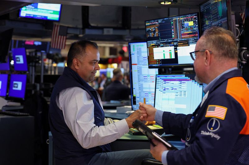 Traders work on the floor at the New York Stock Exchange (NYSE) in New York City, U.S., April 8, 2026. REUTERS/Brendan McDermid
