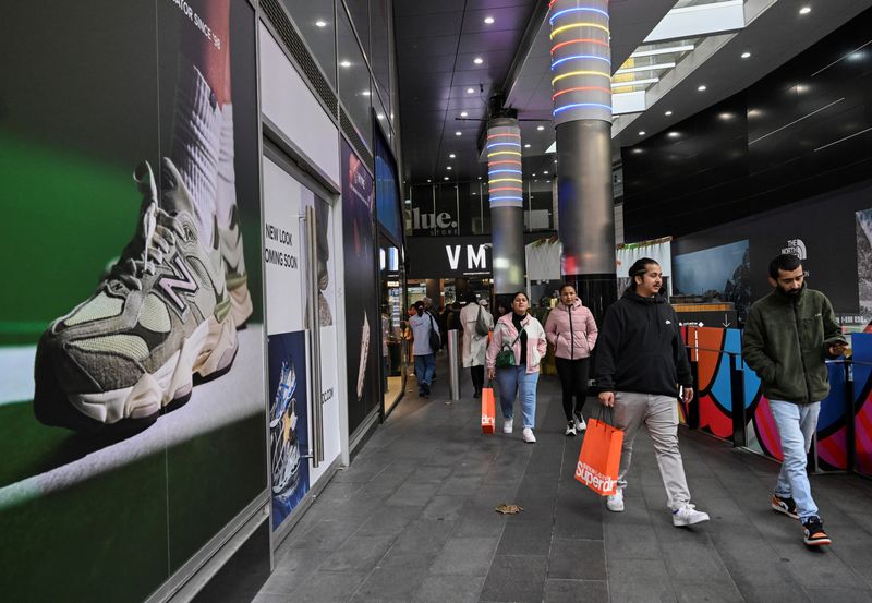 Shoppers walk out of a mall in Sydney's CBD in Sydney, Australia, July 3, 2024. REUTERS/Jaimi Joy