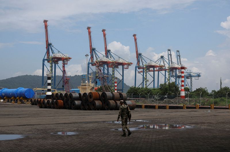 FILE PHOTO: A member of the Central Industrial Security Force (CISF) stands guard at the Jawaharlal Nehru Port (JNPT) in Navi Mumbai, India, September 25, 2025. REUTERS/Francis Mascarenhas/File Photo