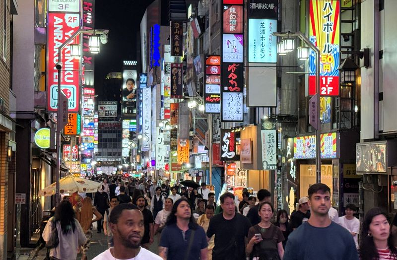 People walk at a shopping area of Shinjuku in Tokyo, Japan, September 11, 2025.     REUTERS/Fabrizio Bensch