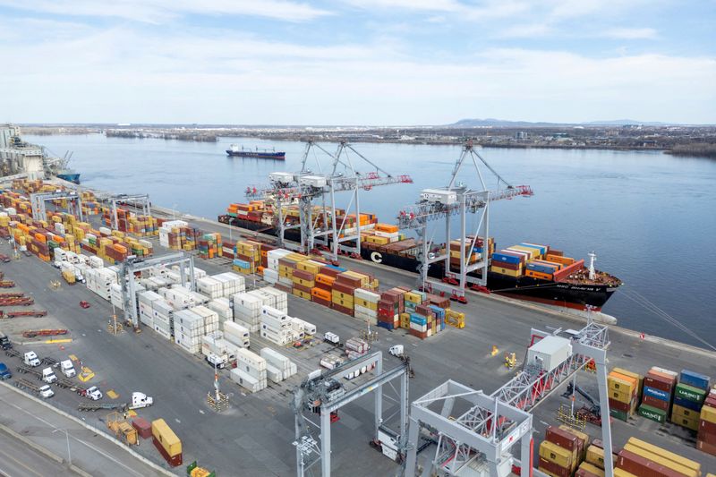 FILE PHOTO: A drone view shows shipping containers and transport trucks at the Port of Montreal in Montreal, Quebec, Canada April 14, 2025. REUTERS/Carlos Osorio/File Photo