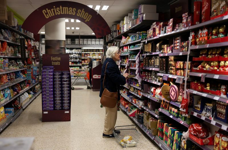 A woman shops in a Waitrose supermarket ahead of Christmas, in London, Britain, December 9, 2025. REUTERS/Hiba Kola