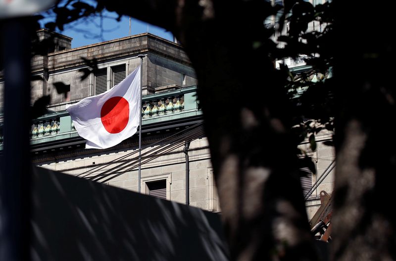 A Japanese flag flutters atop the Bank of Japan building under construction in Tokyo, Japan, September 21, 2017.   REUTERS/Toru Hanai