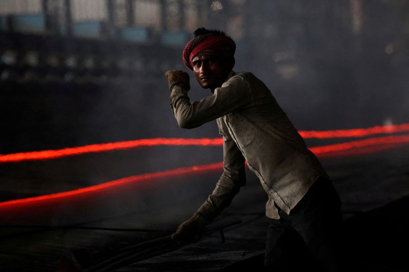 FILE PHOTO: A worker gestures as he works at a steel processing production line of a factory in Mandi Gobindgarh, in the northern state of Punjab, India, August 14, 2025. REUTERS/Bhawika Chhabra//File Photo
