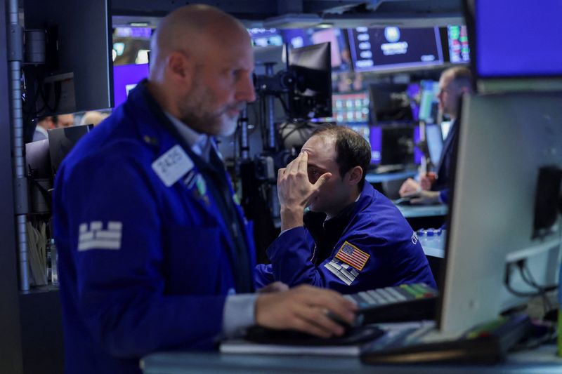 Traders work on the floor at the New York Stock Exchange (NYSE) in New York City, U.S., April 16, 2026. REUTERS/Jeenah Moon