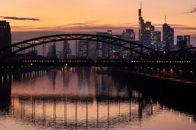 A commuter train passes by the skyline with its financial district ahead of the European Central Bank?s (ECB)  governing council meeting later this week in Frankfurt, Germany, October 25, 2021.  REUTERS/Kai Pfaffenbach