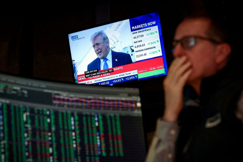 FILE PHOTO: A trader works on the floor at the New York Stock Exchange (NYSE) in New York City, U.S., March 23, 2026.  REUTERS/Brendan McDermid/File Photo