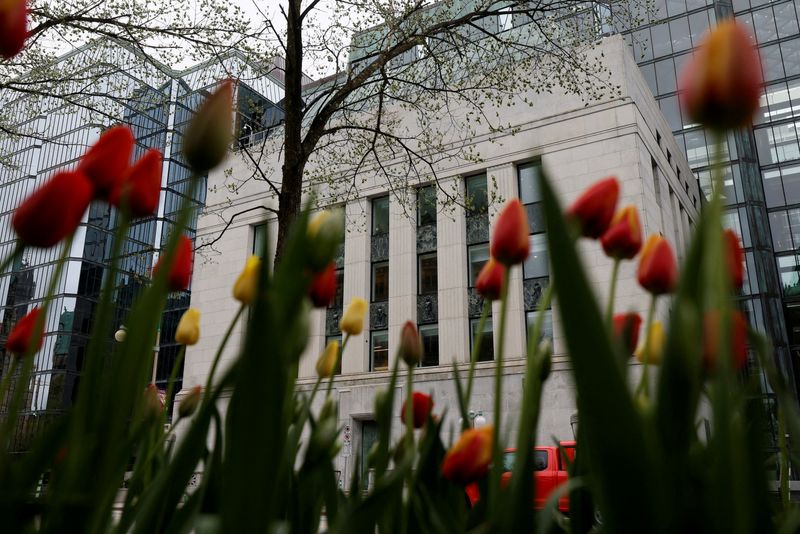 FILE PHOTO: A view of the Bank of Canada building framed by tulips in Ottawa, Ontario, Canada May 8, 2025. REUTERS/Blair Gable/File Photo